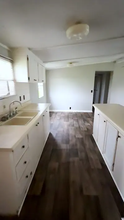Kitchen counters, cabinets and tiled backsplash